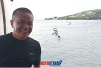 foto istimewa : Wali Kota Palu H.Hadianto Rasyid.S.E berlatar belakang pantai Kilo lima dan para nelayan