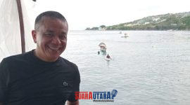 foto istimewa : Wali Kota Palu H.Hadianto Rasyid.S.E berlatar belakang pantai Kilo lima  dan para nelayan 