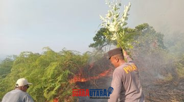 foto istimewa : Saat Anggota polsek Nuhon bersama Warga padamkan Api 