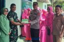 foto istimewa : Kapolsek Kintom Bersama Jajarannya dan Camat  Serahkan Kue HUT TNI 81di kantor koramil 